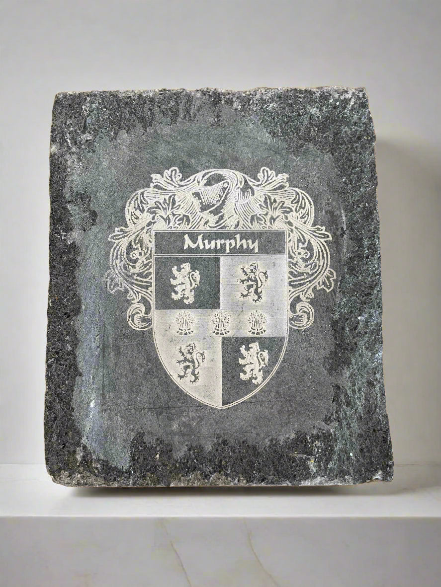 Hand-engraved limestone house sign with Celtic design family crest